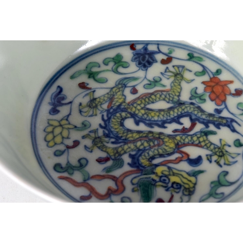 3107 - A small Chinese porcelain polychrome dragon bowl 5 x 14 cm.