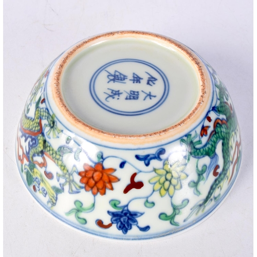 3107 - A small Chinese porcelain polychrome dragon bowl 5 x 14 cm.