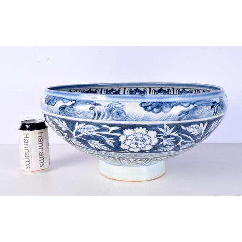 3119 - A large Chinese porcelain blue and white bowl decorated with Phoenix and foliage 19 x 42 cm.