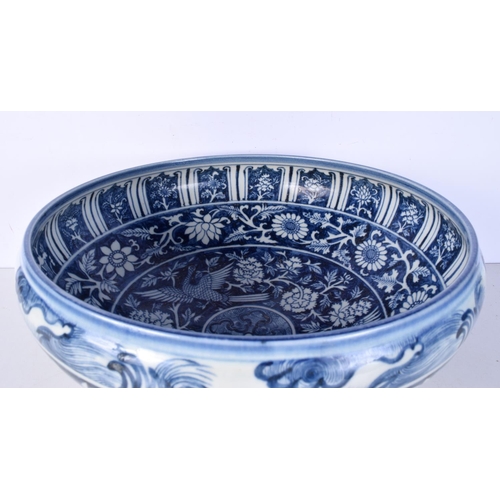 3119 - A large Chinese porcelain blue and white bowl decorated with Phoenix and foliage 19 x 42 cm.