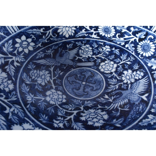 3119 - A large Chinese porcelain blue and white bowl decorated with Phoenix and foliage 19 x 42 cm.