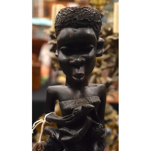 3877 - AN AFRICAN TRIBAL WOOD FIGURE. 60 cm high.