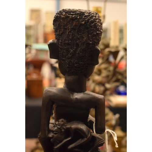 3877 - AN AFRICAN TRIBAL WOOD FIGURE. 60 cm high.