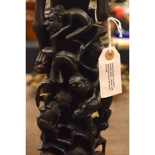 3877 - AN AFRICAN TRIBAL WOOD FIGURE. 60 cm high.