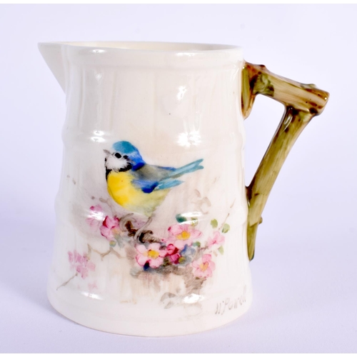 100 - Royal Worcester barrel shaped jug painted with a Goldfinch and another small jug painted with a Blue... 