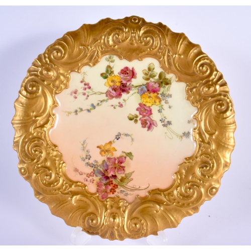 107 - Royal Worcester rare plate with wide moulded heavily gilt border painted with flowers on a blue grou... 