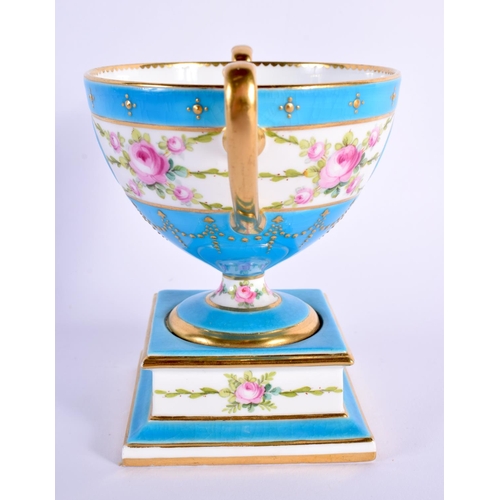 116 - Minton two handled pedestal vase with turquoise ground painted with a band of roses, both sides with... 