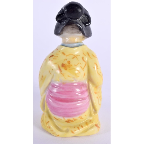 121 - Royal Worcester candle-snuffer of the Japanese Geisha, wearing a yellow rob, date mark 1912 7x3.5cm