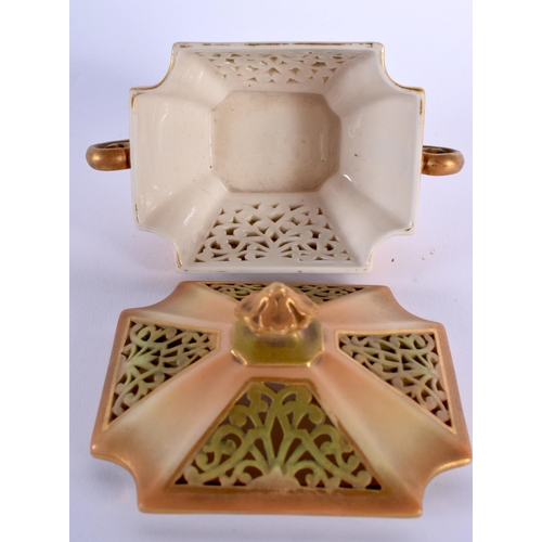 123 - Royal Worcester green and blush ivory reticulated two handled box and cover, date mark 1909 8.5x11cm