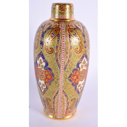 128 - Coalport jewelled bottle vase and cap cover painted with the Cashmere pattern in middle eastern ta... 