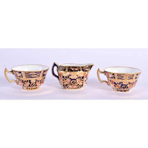 130 - Royal Crown Derby miniature tea service decorated in pattern 62 99 comprising a teapot and cover, su... 