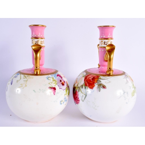 132 - Late 19th/ early 20th century Minton pair of two handled vases painted with roses or pansies under a... 