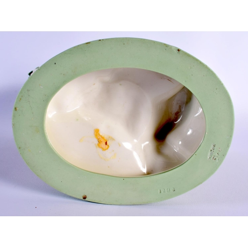 137 - Minton porcelain celadon shell dish, the shell supported by a sea god, impressed marks 21.5x23cm