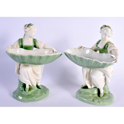 138 - Minton porcelain celadon pair of sweetmeat or bonbon dish figures, depicted as a seated maiden holdi... 