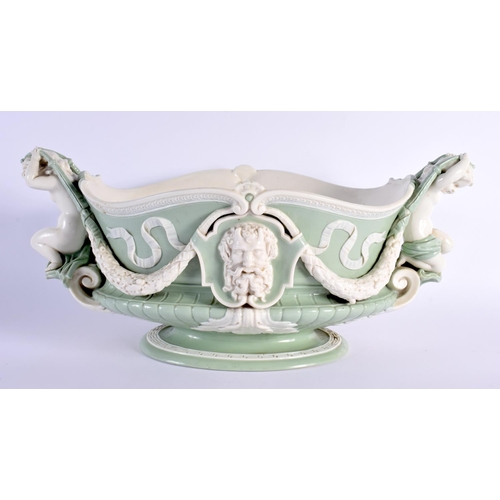 139 - Minton pale green and white glazed porcelain oval two handled urn pattern jardiniere of shaped and m... 