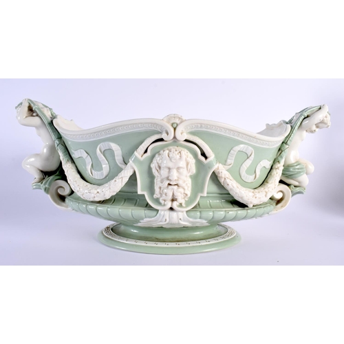 139 - Minton pale green and white glazed porcelain oval two handled urn pattern jardiniere of shaped and m... 