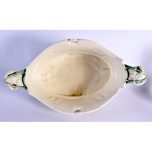 139 - Minton pale green and white glazed porcelain oval two handled urn pattern jardiniere of shaped and m... 