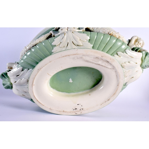 139 - Minton pale green and white glazed porcelain oval two handled urn pattern jardiniere of shaped and m... 