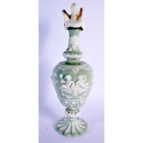 140 - Minton porcelain celadon pedestal ewer of oviform with raised neck, foliate spout, the handle formed... 