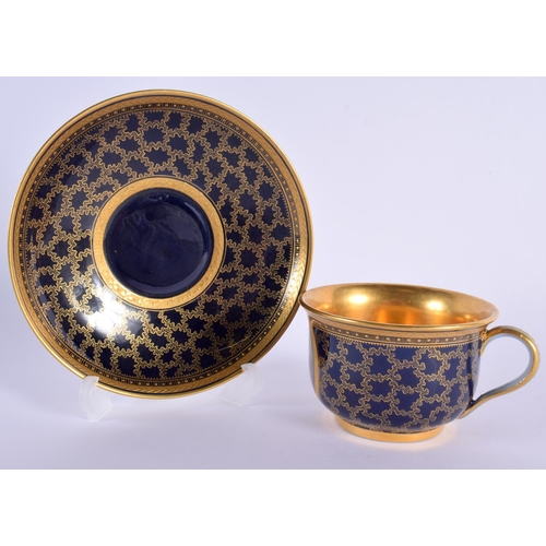 145 - Late 19th century Meissen cabinet cup and saucer in Sevres style, the dark blue ground with a gilt v... 