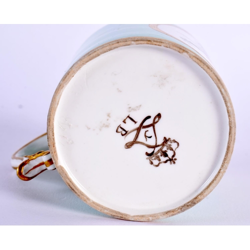 168 - Sevres hard paste coffee can painted with musical instrument in an oval gilt panel on a light green ... 