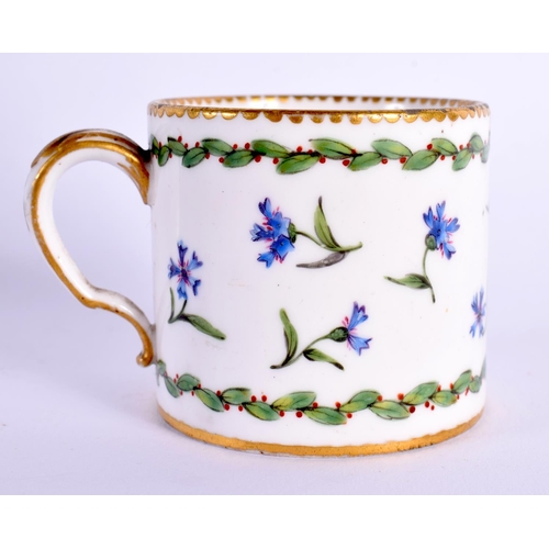 172 - Sevres small coffee can and stand painted with cornflowers and chains of berried leaves,  Crossed L... 