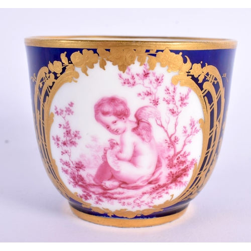 177 - Sevres blue ground cup and saucer painted in puce with children surrounded by gilt flowers, crossed ... 