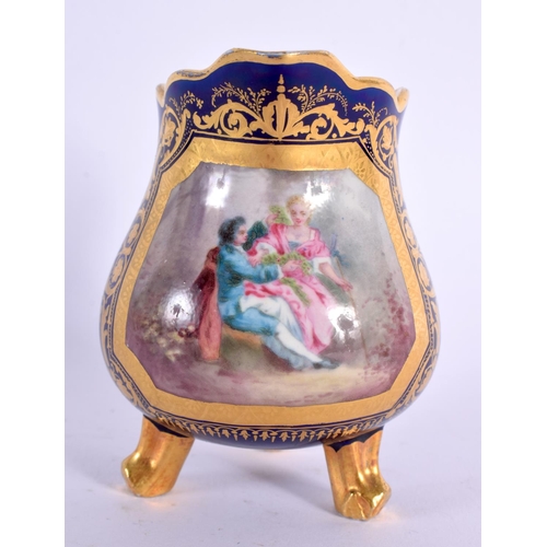 180 - Sevres three footed cream jug with cobalt blue ground painted with a courting couple in an elaborate... 