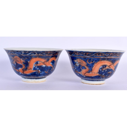 209 - A PAIR OF 19TH CENTURY CHINESE CORAL DRAGON BLUE AND WHITE TEABOWLS bearing Kangxi marks to base, to... 