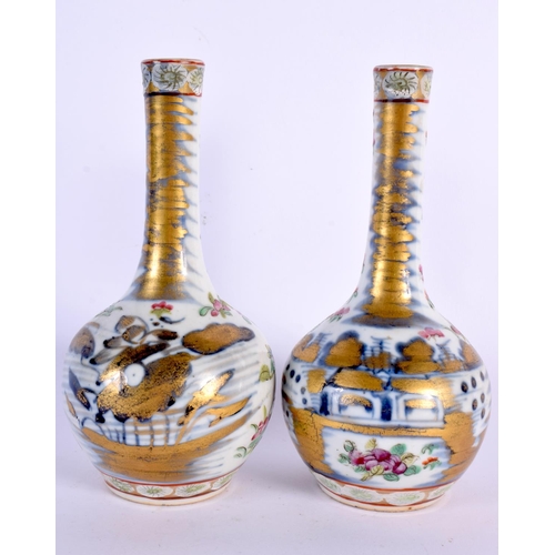 211 - A PAIR OF 19TH CENTURY CHINESE FAMILLE ROSE CLOBBERED VASES Qing. 17 cm high.