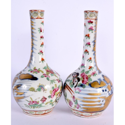 211 - A PAIR OF 19TH CENTURY CHINESE FAMILLE ROSE CLOBBERED VASES Qing. 17 cm high.