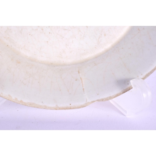 220 - A RARE CHINESE PALE CREAM GLAZED FOLIATE RIM DISH Song/Yuan dynasty. 13 cm wide. Note: See Sothebys,... 