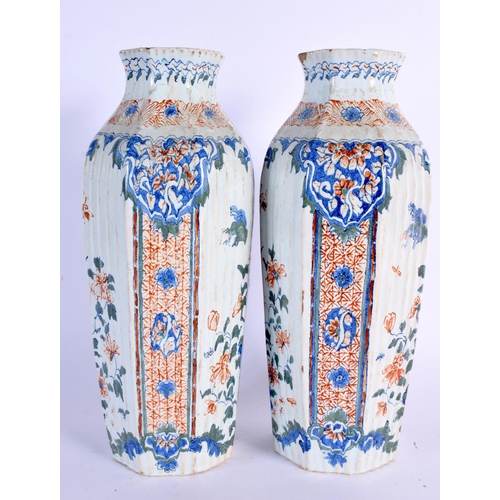 238 - A RARE PAIR OF 18TH CENTURY DUTCH DELFT FAIENCE VASES painted with birds and landscapes. 25 cm high.