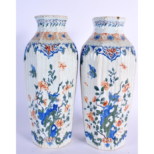 238 - A RARE PAIR OF 18TH CENTURY DUTCH DELFT FAIENCE VASES painted with birds and landscapes. 25 cm high.