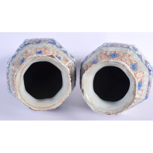 238 - A RARE PAIR OF 18TH CENTURY DUTCH DELFT FAIENCE VASES painted with birds and landscapes. 25 cm high.