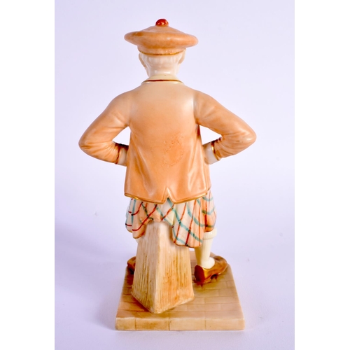 24 - A ROYAL WORCESTER FIGURE OF A SCOTSMAN. 15 cm high.