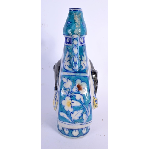 245 - A MIDDLE EASTERN PERSIAN BLUE GLAZED TWIN HANDLED POTTERY VASE decorated in relief with an elephant ... 