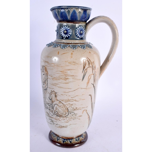 255 - A DOULTON LAMBETH STONEWARE SCRAFITO JUG by Hannah Barlow. 23 cm high.