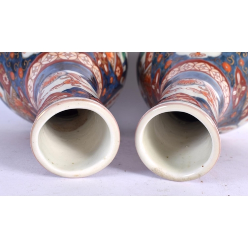 256 - A PAIR OF 18TH CENTURY JAPANESE EDO PERIOD IMARI VASES painted with landscapes. 24 cm x 11 cm.