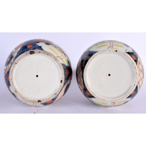 256 - A PAIR OF 18TH CENTURY JAPANESE EDO PERIOD IMARI VASES painted with landscapes. 24 cm x 11 cm.