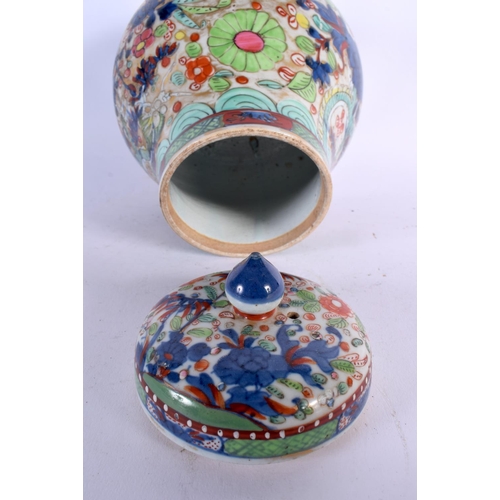 257 - A CHINESE QING DYNASTY CLOBBERED PORCELAIN VASE AND COVER Kangxi/Yongzheng. 21 cm x 14 cm.