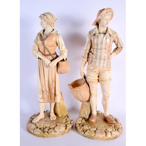 260 - A LARGE PAIR OF HADLEY ROYAL WORCESTER BLUSH IVORY FIGURES modelled with baskets. 45 cm x 15 cm.