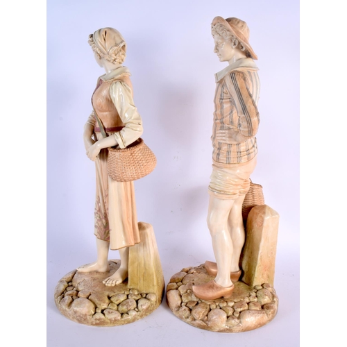 260 - A LARGE PAIR OF HADLEY ROYAL WORCESTER BLUSH IVORY FIGURES modelled with baskets. 45 cm x 15 cm.