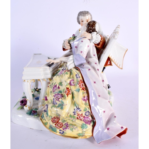 265 - A MEISSEN PORCELAIN FIGURE OF A CLAVICHORD PLAYER painted with flowers. 21 cm x 21 cm.