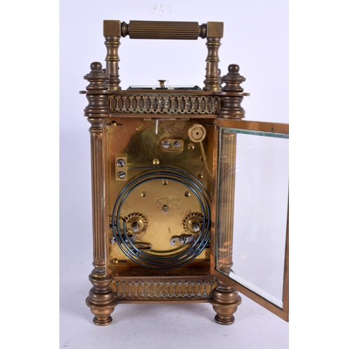 274 - AN ANTIQUE REPEATING FRENCH BRASS CARRIAGE CLOCK. 18 cm high.