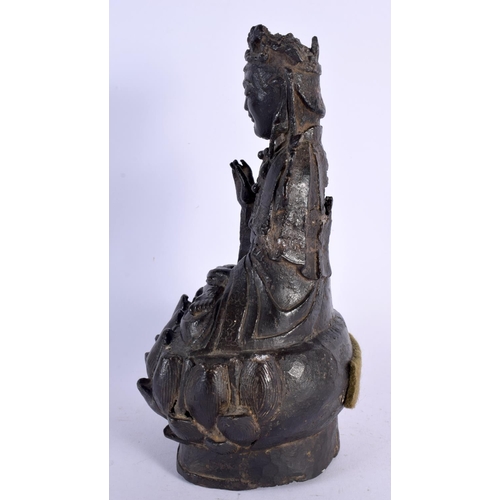 280 - A 16TH/17TH CENTURY CHINESE BRONZE FIGURE OF A BUDDHA Ming, modelled upon a lotus capped base. 27 cm... 