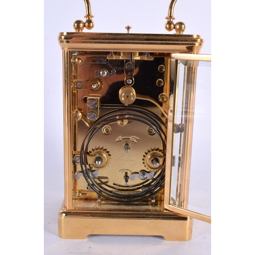 297 - AN ANGELUS REPEARTING MOON PHASE CARRIAGE CLOCK. 17 cm high inc handle.