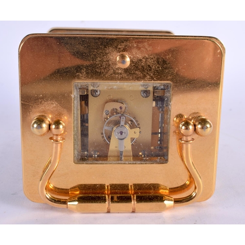 297 - AN ANGELUS REPEARTING MOON PHASE CARRIAGE CLOCK. 17 cm high inc handle.