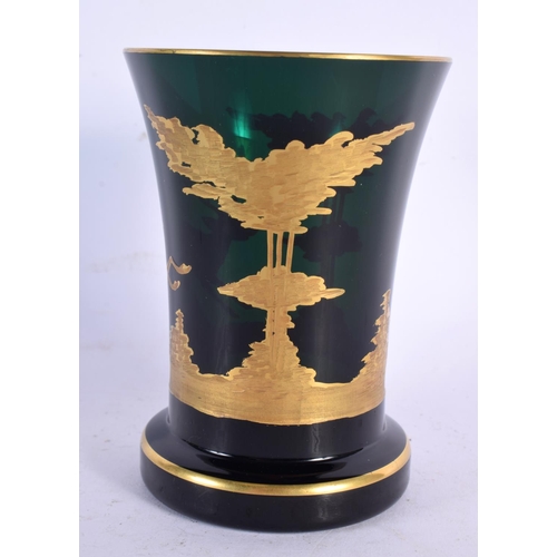 299 - AN ANTIQUE BOHEMIAN GREEN AND GILT GLASS BEAKER. 12 cm x 8 cm.