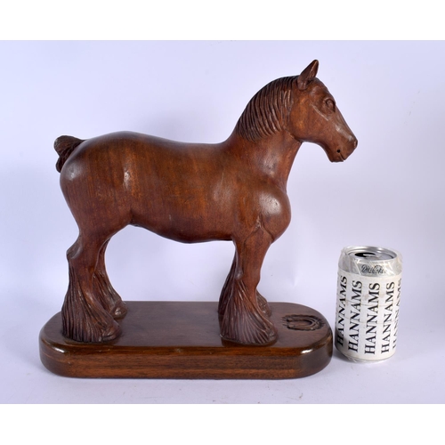 303 - A LARGE 1950S CARVED OAK FIGURE OF A STANDING HORSE in the manner of Robert Mouseman. 30 cm x 27 cm.